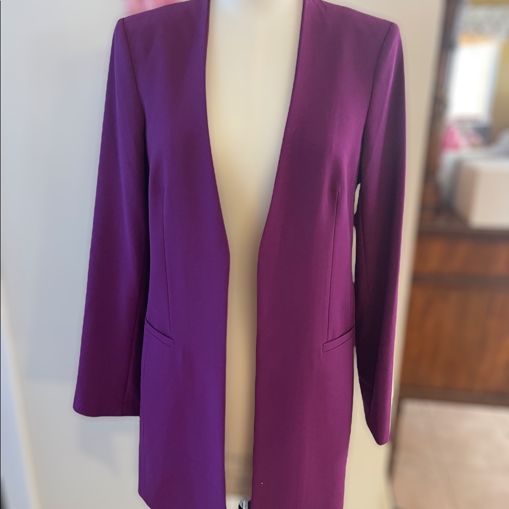 Calvin Klein ladies mid length jacket. Size US 8. Never used.